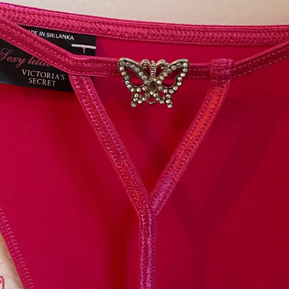 Victoria's Secret Vibrant Pink Thong with rhinestone Butterfly design.
